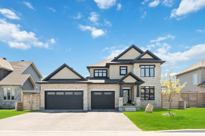 Houses For Sale in Kanata, Jason Polonski, Realtor, Ottawa, 2023-05-14. Detached home with 3 car garage, blue sky. Home For Sale by Jason Polonski, Ottawa and Kanata Realtor