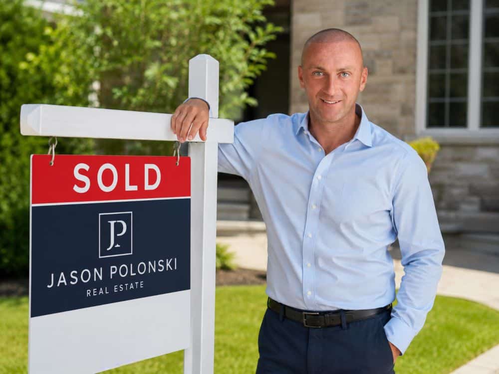 Jason Polonski- Realtor in Kanata, Ottawa is standing next to his sign